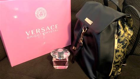 free versace black and gold bag with fragrance purchase|versace perfume with free backpack.